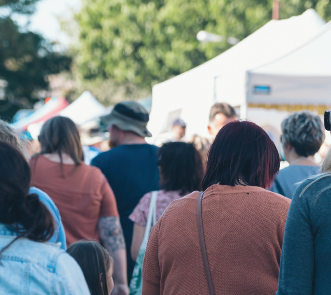 social cohesion, a group of people in a crowd with their backs to the camera